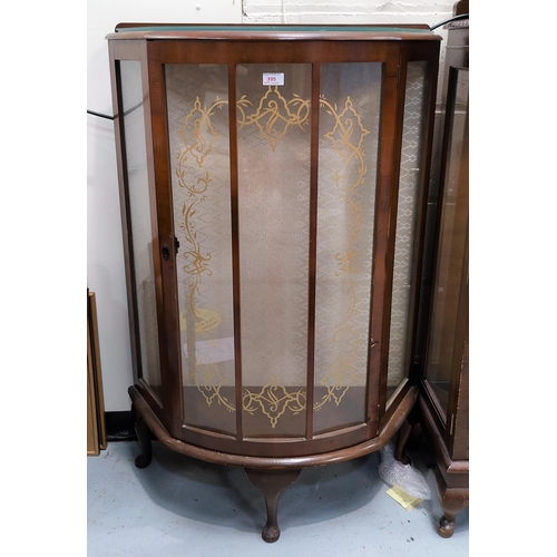 805 - A 1950's walnut demi-lune display cabinet