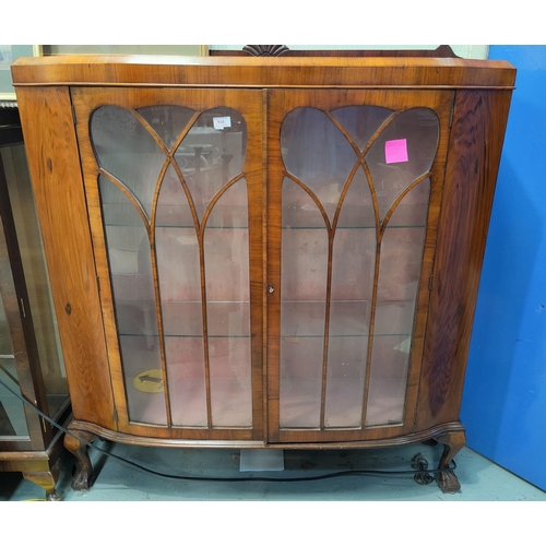 808 - A 1930's 'D' front 2 door display cabinet on ball and claw feet