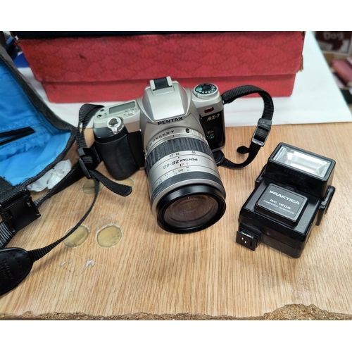 88A - A Pentax SLR camera with lens etc