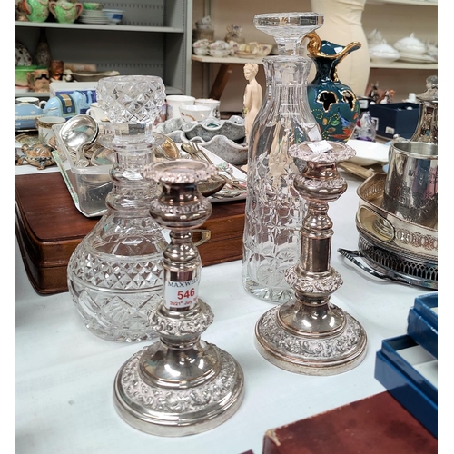 546 - A 19th century pair of telescopic candlesticks in ornate Sheffield plate; 2 glass decanters