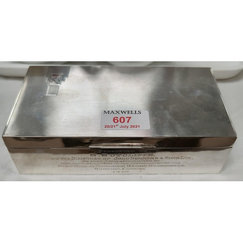 607 - A hall marked silver Cigarette Box with monogrammed engine turned lid, dedication to the front.  She... 