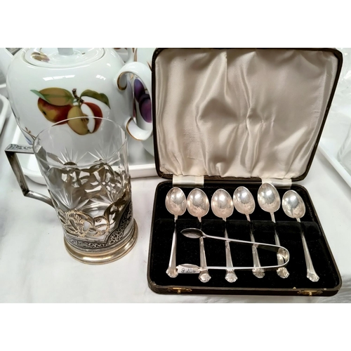 607B - A set of six cased teaspoons, Sheffield 1940, 2.1 oz; a pair of hallmarked silver sugar tongs, Sheff... 