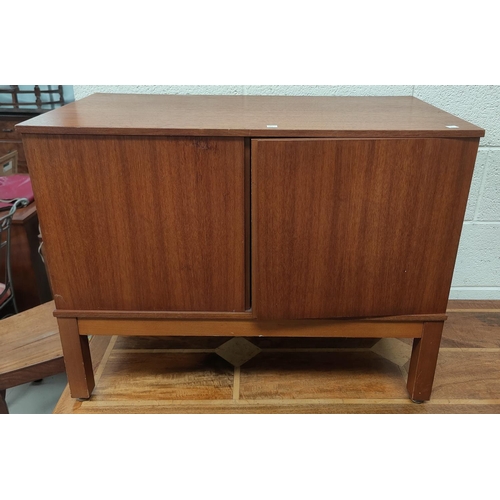 813 - A mid 20th century teak record cupboard with double doors