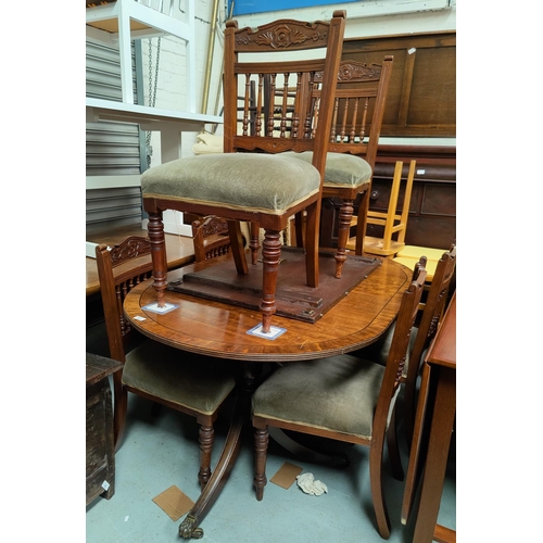 787 - A regency style inlaid mahogany tilt top double pedestal dining table with brass lions feet on caste... 