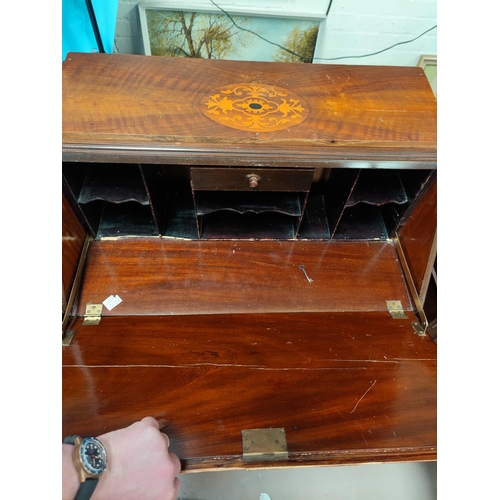 818 - An early 20th century inland mahogany fall front bureau