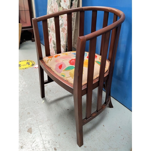 820B - A mahogany bow stick back armchair