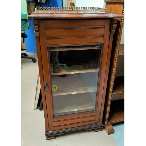 826 - An Edwardian mahogany music cabinet with brass gallery and glass door