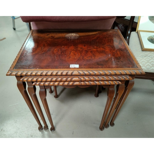 761 - A figured walnut nest of 3 occasional tables
