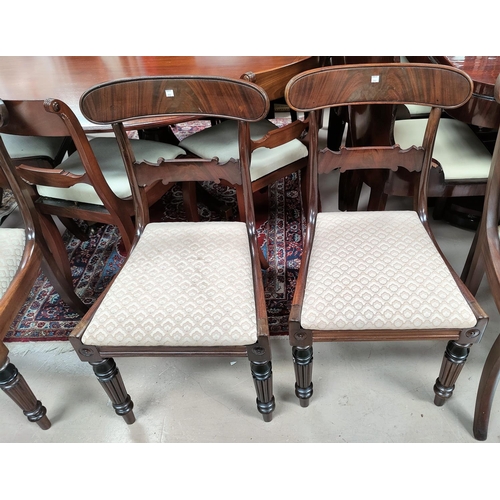 717 - An early 19th century set of 4 mahogany dining chairs with wide top rails, drop in seats in brown, o... 