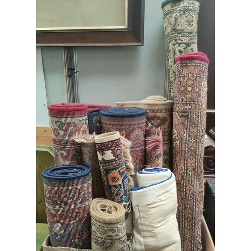 811a - A selection of various small carpets and rugs.