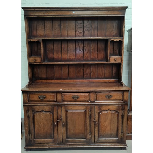 838 - An 18th century style distressed oak Welsh dresser in the Titchmarsh & Goodwin manner with 2 height ... 