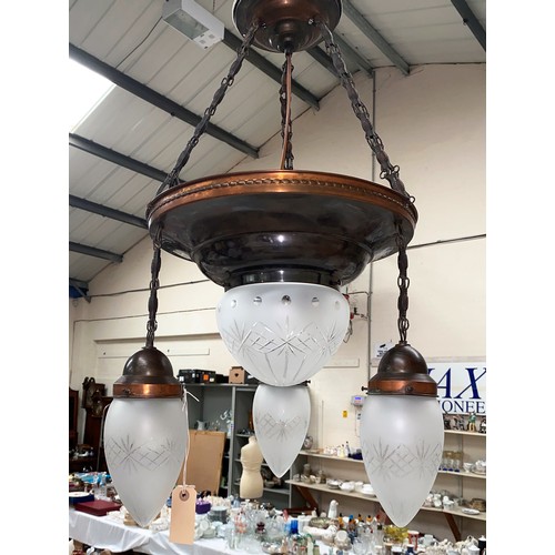 766A - An Arts and Crafts style pendant ceiling light fitting with copper colour fittings, central cut glas... 
