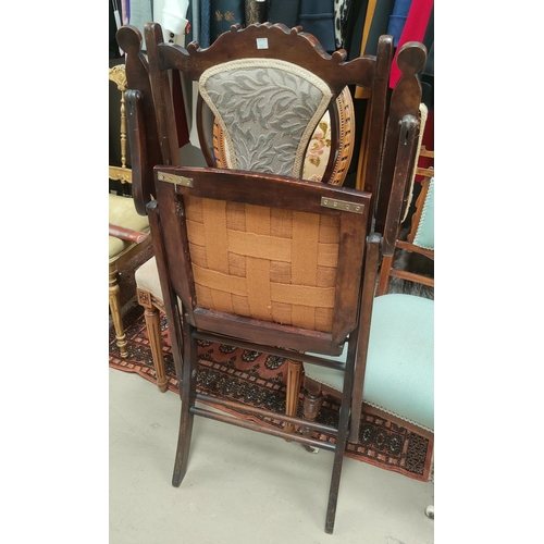 731 - An Edwardian inlaid rosewood nursing chair in light blue; an Edwardian stained mahogany folding armc... 