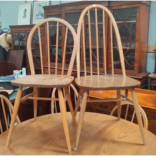 830 - A set of 3 Ercol lightwood high hoop and stick back dining chairs and 3 Ercol low backs.