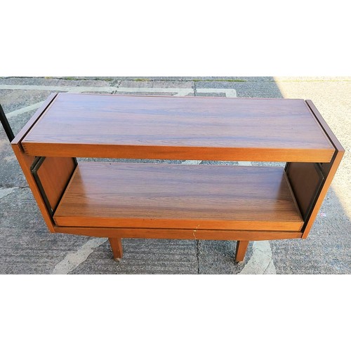 721a - A c1970's teak and veneer 2- height side table with pull up leaf, on castors