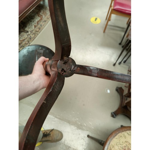 829 - An Edwardian stained mahogany tub shaped armchair and a wine table