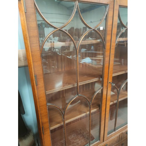 844 - An Edwardian walnut full height bookcase with 2 glazed doors over 2 cupboards and 2 drawers