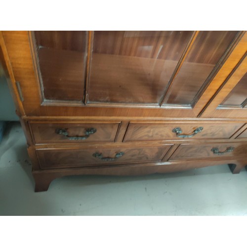 844 - An Edwardian walnut full height bookcase with 2 glazed doors over 2 cupboards and 2 drawers