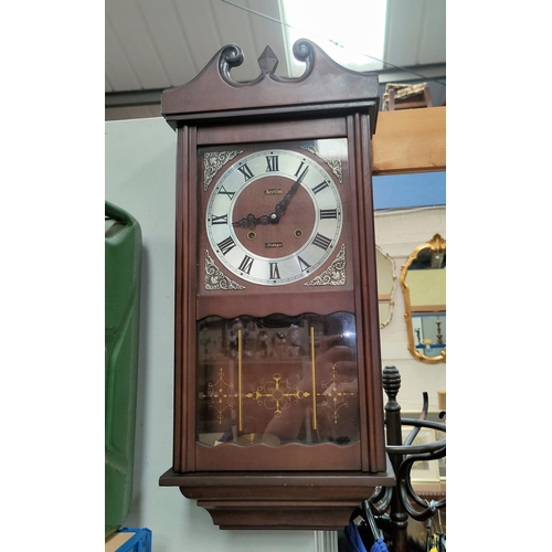 4 - A mahogany cased reproduction Acctim 31 day wall clock.  70cm