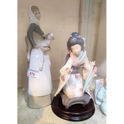 420 - A Lladro figure of a Japanese girl (flower stem a.f) and two other Lladro figures