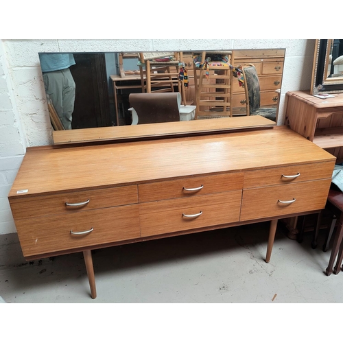 762 - A mid 20th century lightwood dressing table with 6 drawers, single long mirror, on tapering legs wit... 