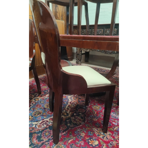 775 - An Art Deco dining suite comprising rounded rectangular table with ebonised mouldings on 'U' shaped ... 