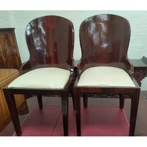 775 - An Art Deco dining suite comprising rounded rectangular table with ebonised mouldings on 'U' shaped ... 