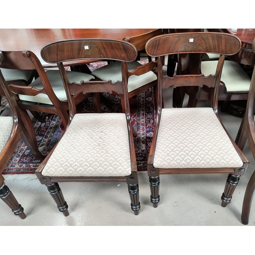 774 - An early 19th century set of 4 mahogany dining chairs with wide top rails, drop in seats in brown, o... 