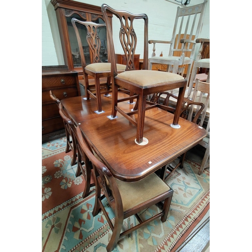 776 - A reproduction Georgian mahogany dining suite comprising rounded rectangular extending twin pedestal... 