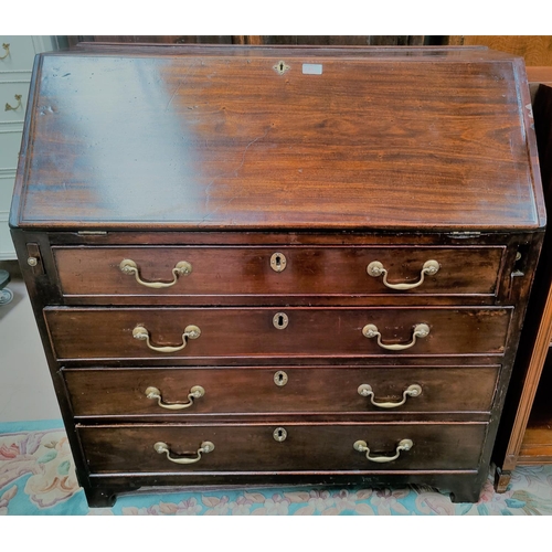 763 - A Georgian mahogany bureau with fitted interior four drawers bellow, with brass swan neck handles, w... 