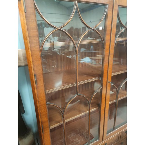 772 - An Edwardian walnut full height bookcase with 2 glazed doors over 2 cupboards and 2 drawers