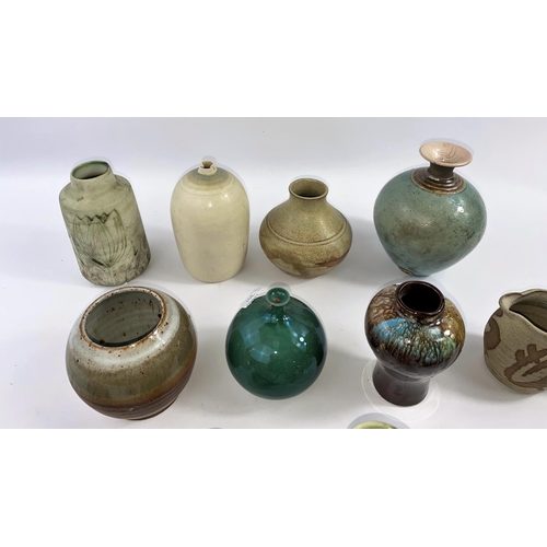 351 - A large selection of small stoneware Studio pottery vases, several with maker's monograms