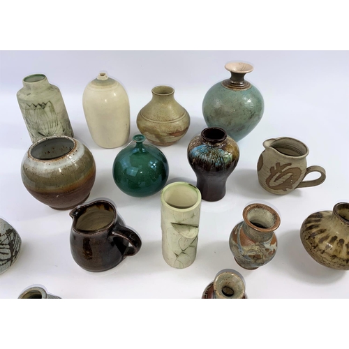 351 - A large selection of small stoneware Studio pottery vases, several with maker's monograms