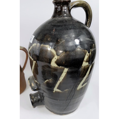 356 - A large brown glazed studio pottery barrel height 39cm; a slip glazed salt container; an Ambleside p... 