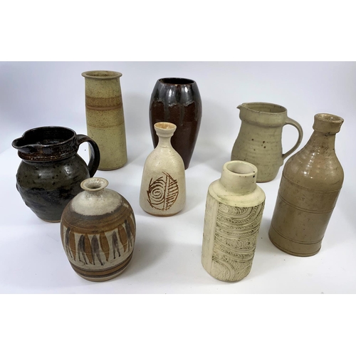 358 - A selection of 8 studio pottery vases and jugs including pieces by Tony Gant, Carn Pottery etc