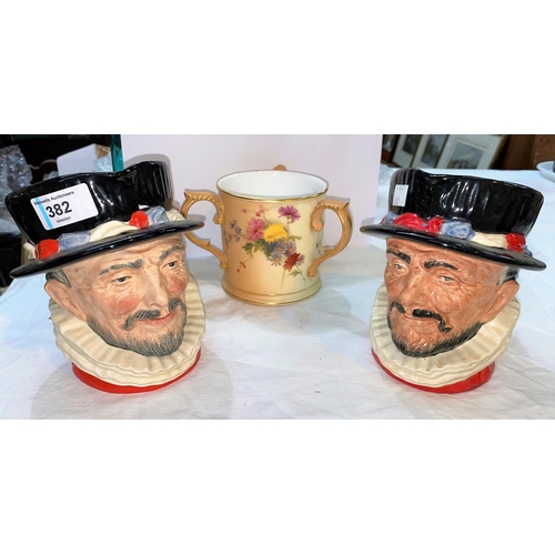 382 - Two Royal Doulton Beefeater character jugs and a Royal Worcester peach ground three handled jug