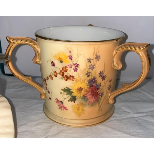 382 - Two Royal Doulton Beefeater character jugs and a Royal Worcester peach ground three handled jug