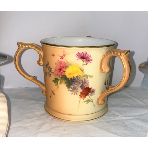 382 - Two Royal Doulton Beefeater character jugs and a Royal Worcester peach ground three handled jug