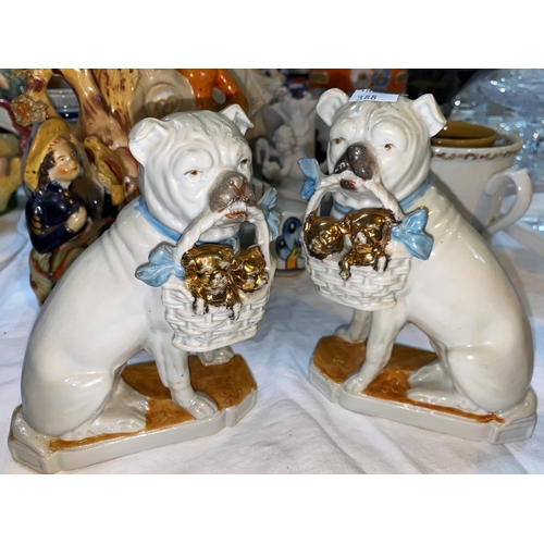 388 - A pair of staffordshire bull dogs with a basket of puppies: 2 Staffordshire dogs and other decorativ... 