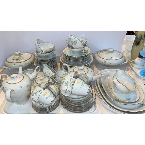 419 - A German KPM hand painted part dinner and tea service with gilt border and central flowers approx 70... 