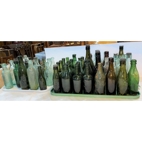 431 - A large selection of vintage glass bottles