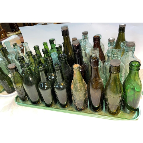 431 - A large selection of vintage glass bottles