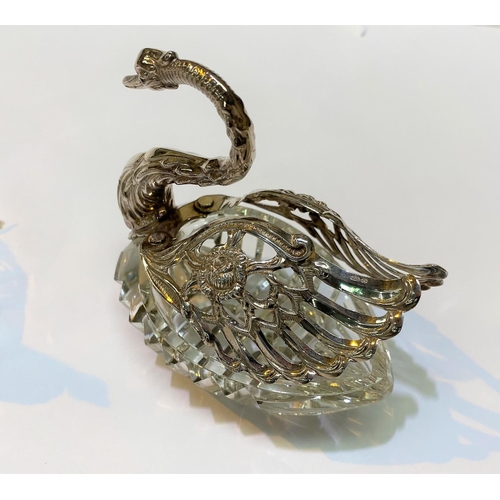 563 - A pair of cut glass swan salts with hallmarked silver heads, necks and wings import marks for London... 