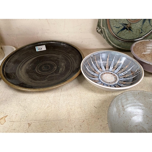 354 - A selection of glazed and unglazed Studio pottery dishes, some monogrammed