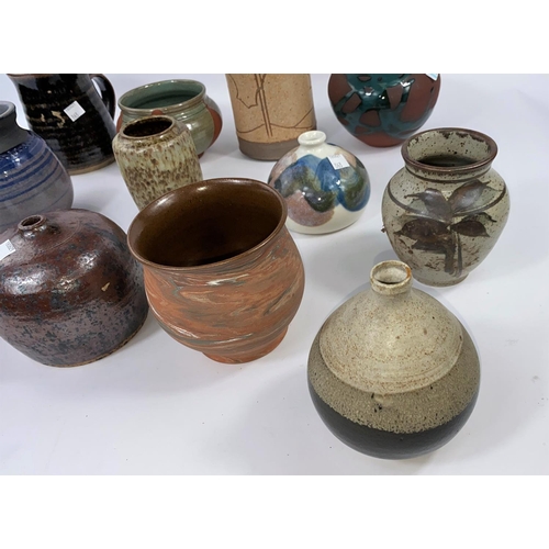 363 - 12 various glazed and unglazed stoneware Studio pottery vases some monogrammed