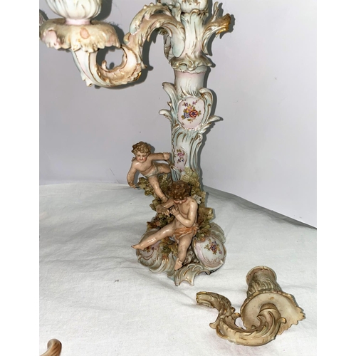 386 - A pair of 19th century Dresden 3 branch candelabra heavily encrusted with foliage, cherubs etc ht 40... 