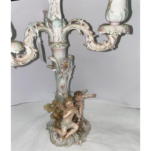 386 - A pair of 19th century Dresden 3 branch candelabra heavily encrusted with foliage, cherubs etc ht 40... 