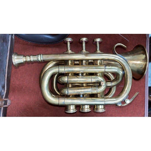 163 - A Boosey and Co miniature cornet 9459 length 23cm