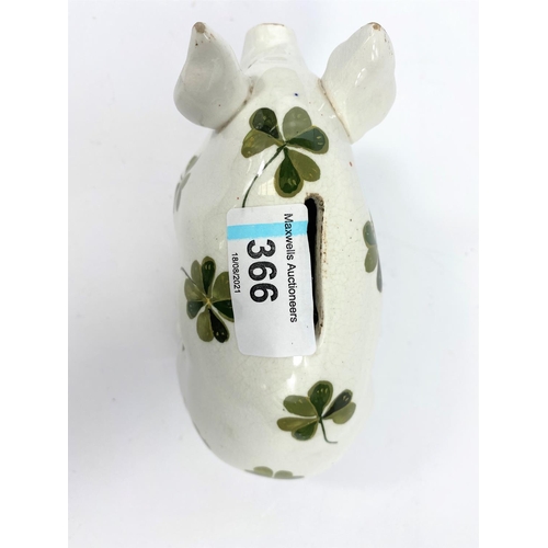 366 - A Wemyss piggy bank, decorated in the clover pattern, marked 'WEMYSS' to base, 9.5cm high, 16cm long