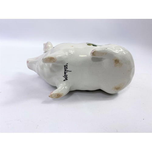 366 - A Wemyss piggy bank, decorated in the clover pattern, marked 'WEMYSS' to base, 9.5cm high, 16cm long